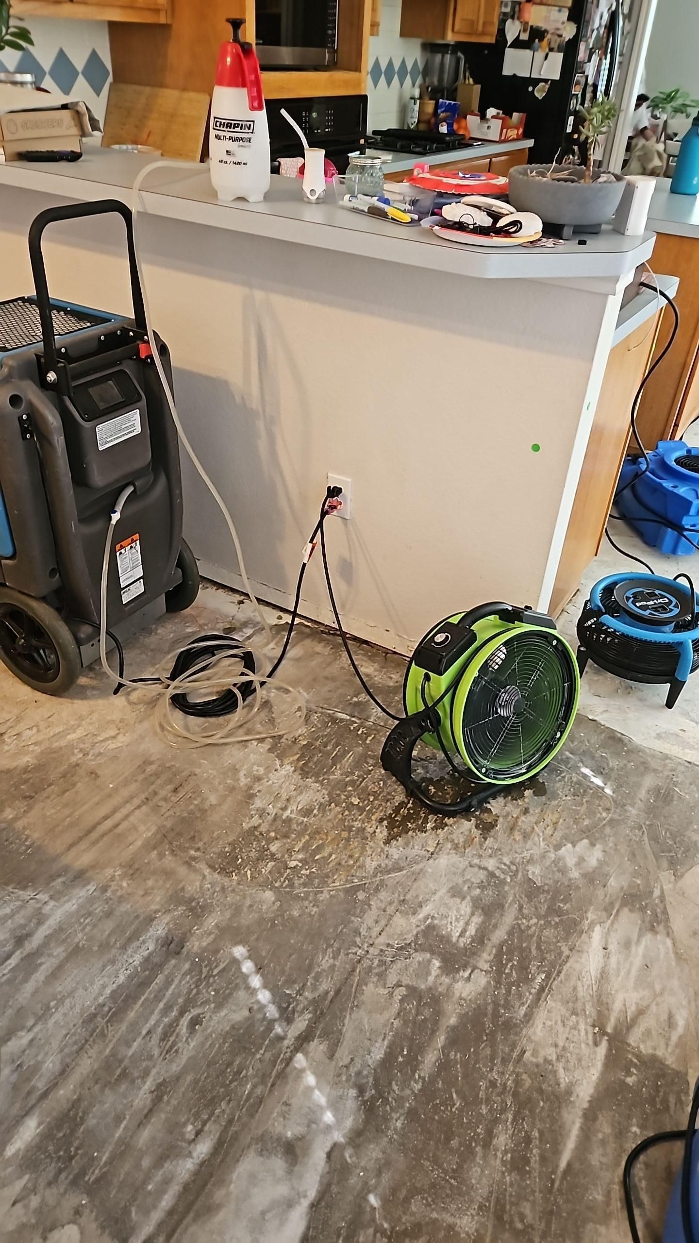 Living room flooring removed during water damage mitigation