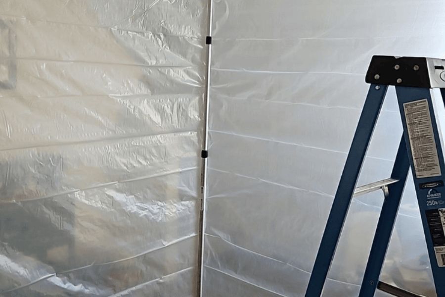 Containment barrier setup during water damage restoration