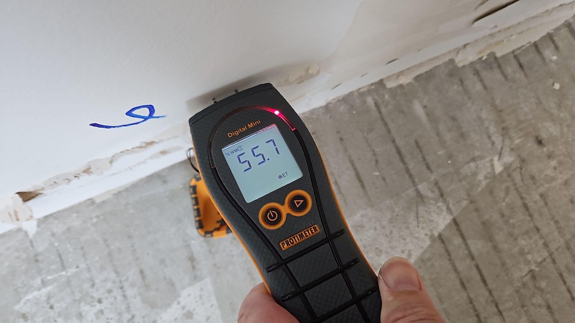 Moisture meter showing 55.7% readings