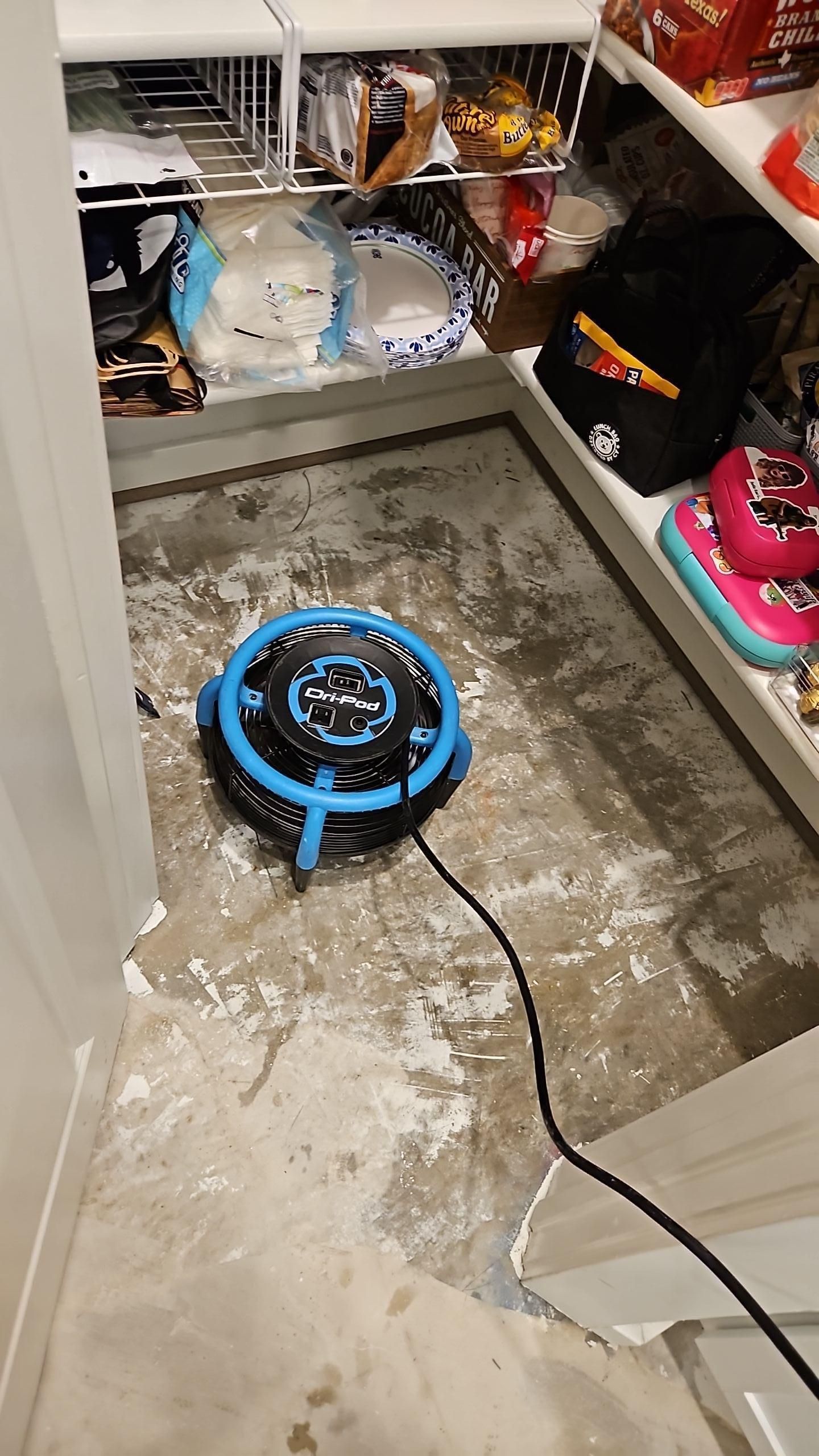 Pantry area after flooring removal with drying equipment set up