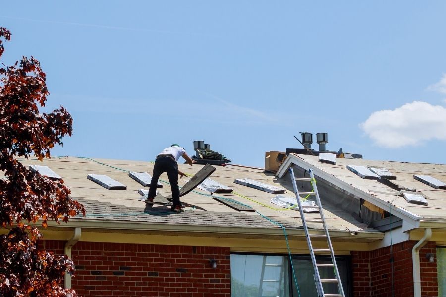 Texas Certified Restoration crew assessing and working on a storm-damaged roof in the Greater Austin area