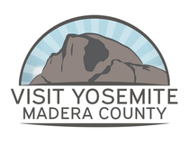 Logo  Depicts a stylized mountain within a blue arch with radiating lines, with the text 