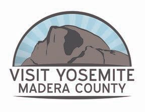 A logo for yosemite madera county with a mountain in the background.