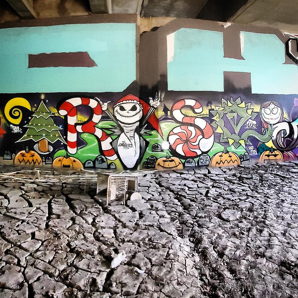 A nightmare before christmas themed graffiti on a wall