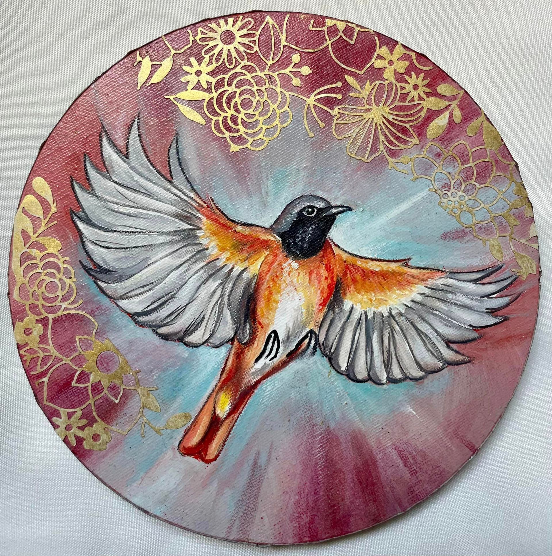 oiseau de feu en plein vol