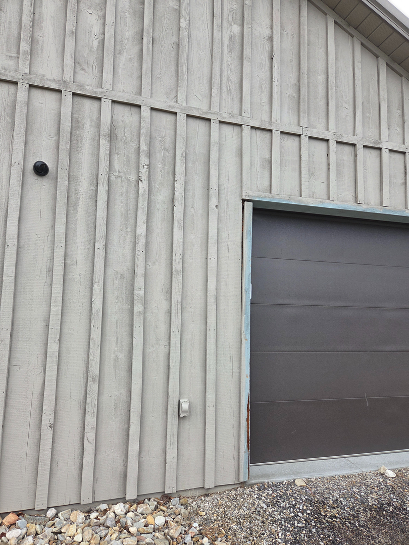 Security camera mounted on rural shop exterior in Hamilton Montana — Smart Home Solutions affordable security installation serving the Bitterroot Valley