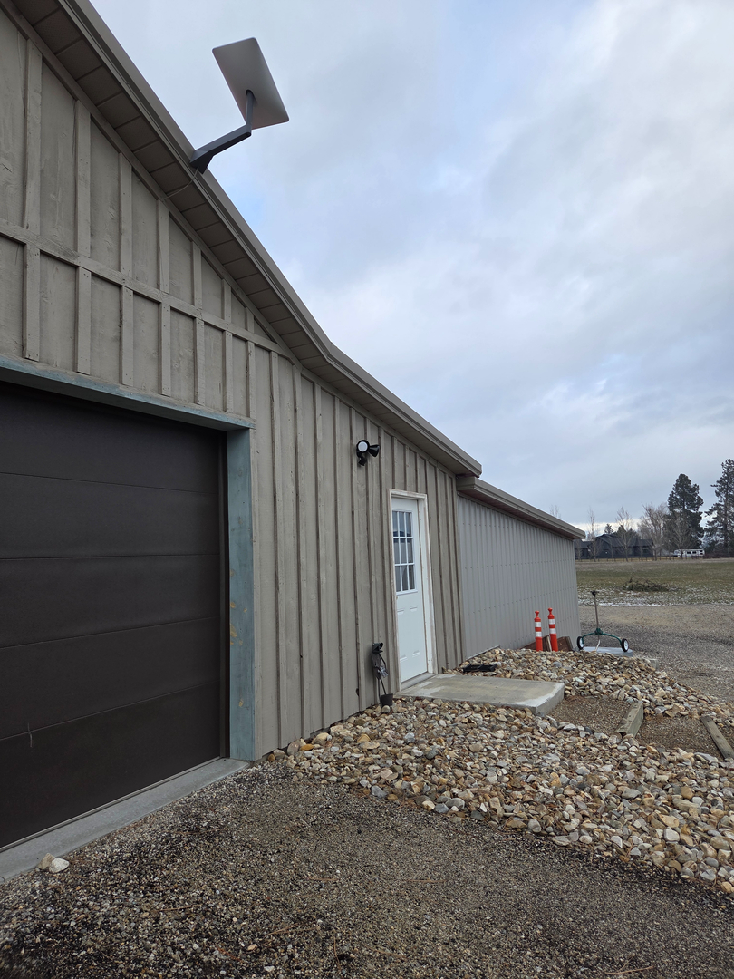 Starlink dish and Ring security camera installation on rural shop in Hamilton Montana — Smart Home Solutions serving the Bitterroot Valley
