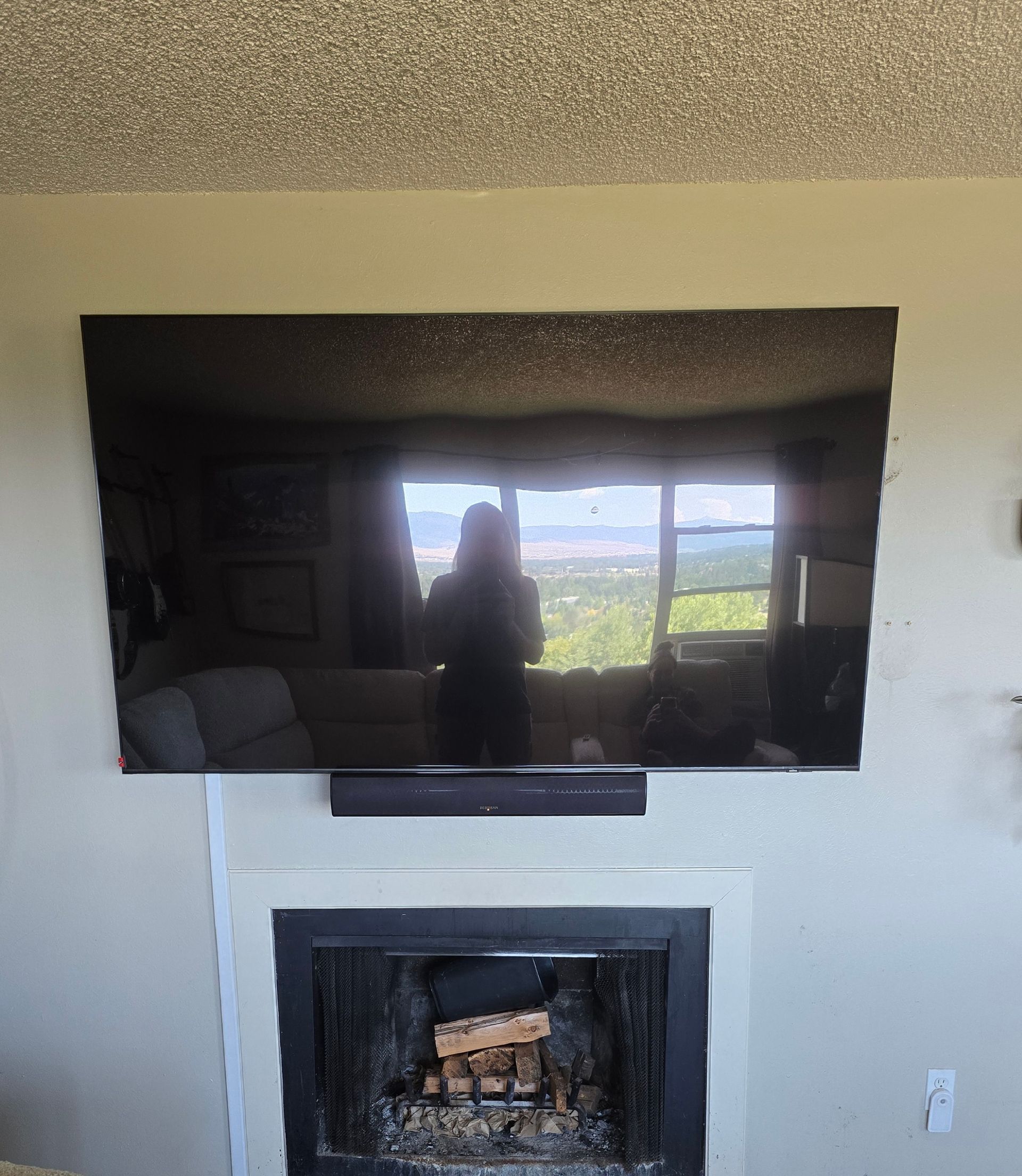 TV and soundbar above fireplace with cable concealment in Missoula Montana — Smart Home Solutions