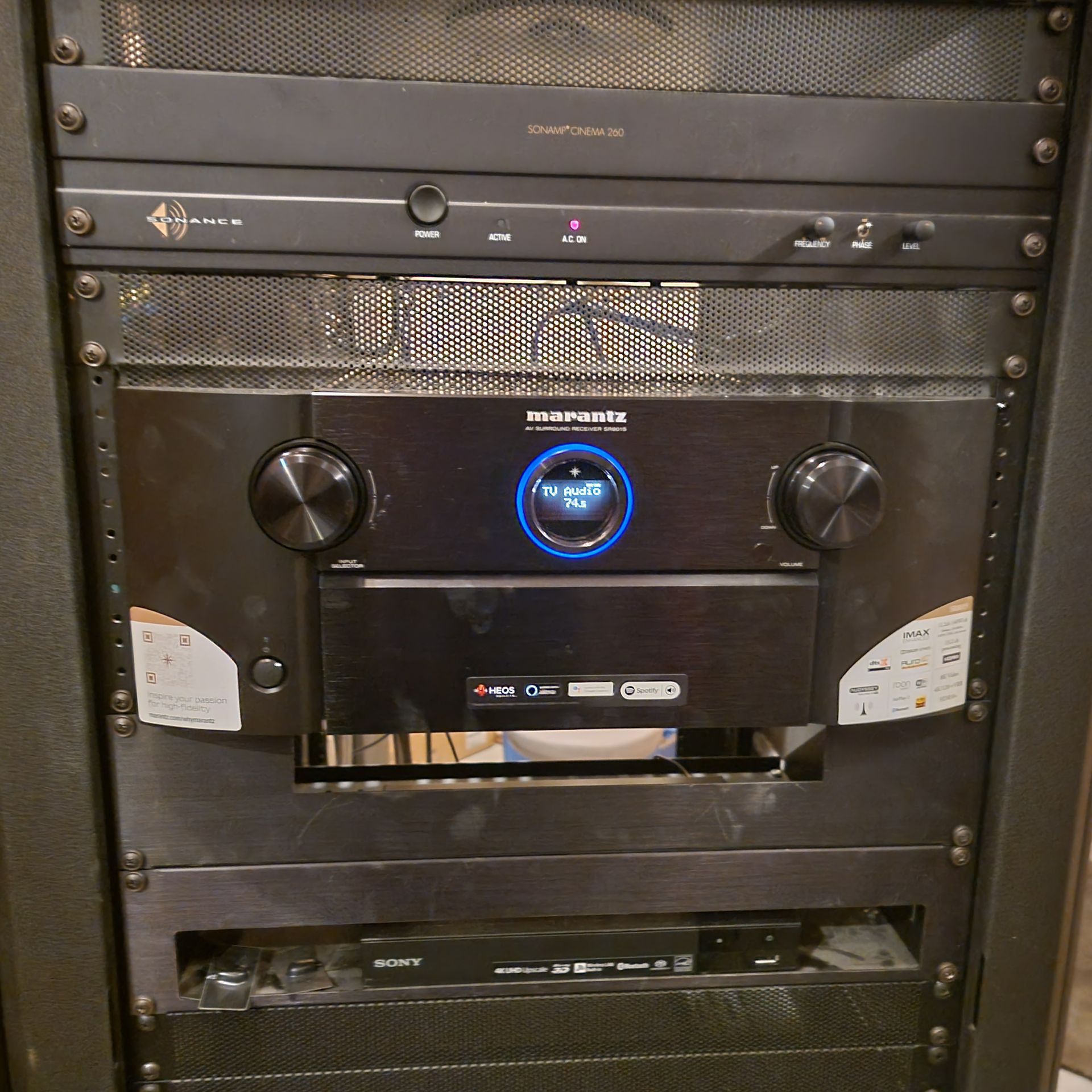 Marantz surround sound receiver and Sonance amplifier installed in home theater rack in Hamilton, MT — Smart Home Solutions