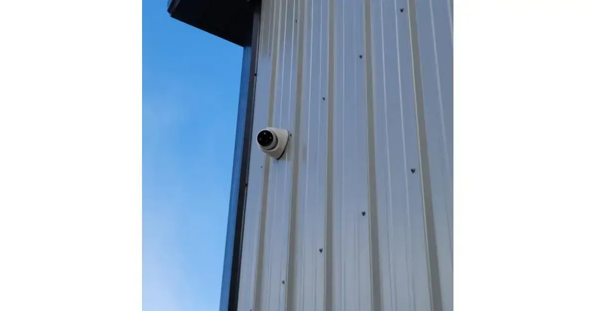 Outdoor security camera installed on commercial metal building for property surveillance in Hamilton Montana