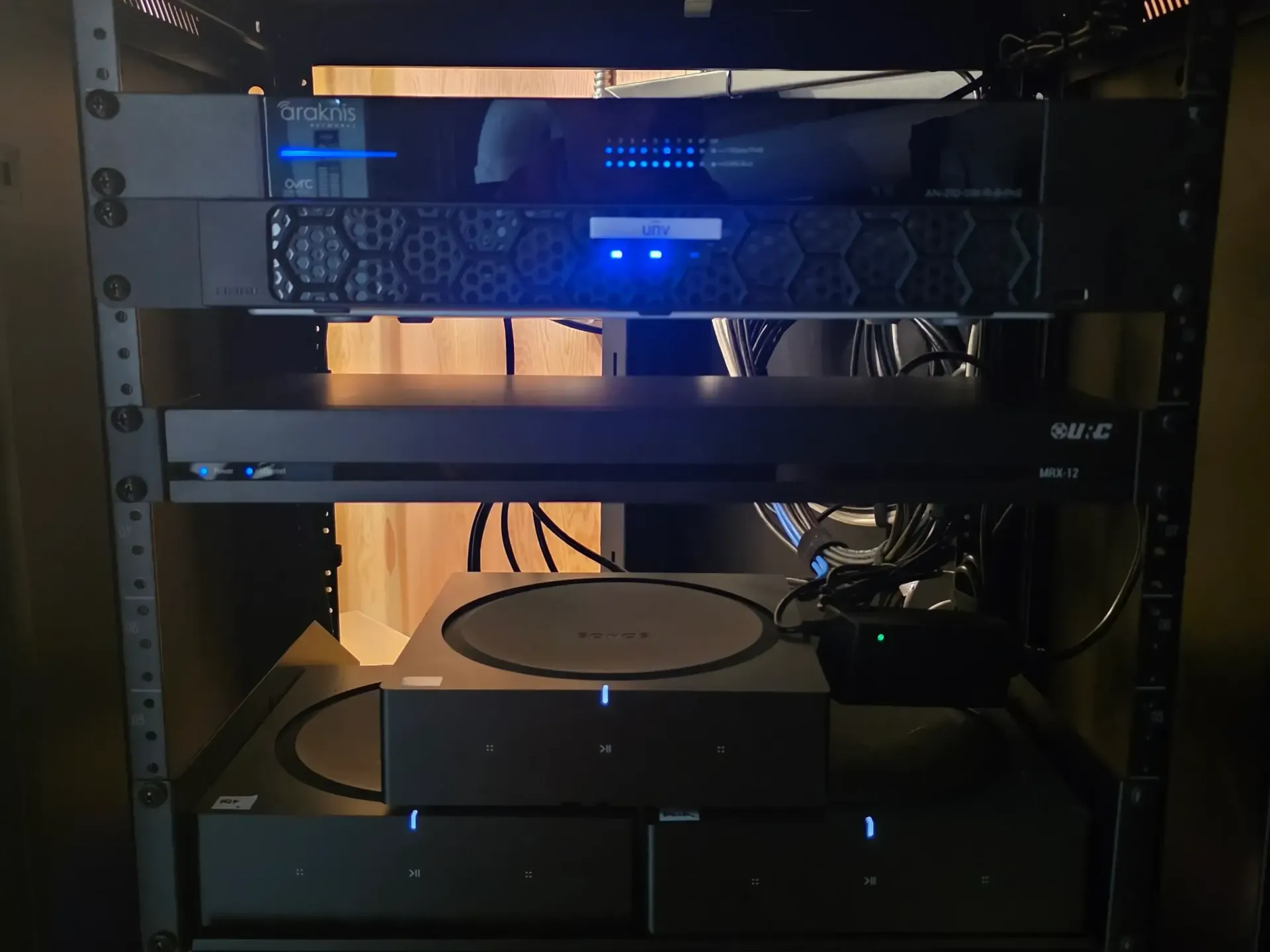 Sonos amplifiers, URC home automation controller, and Uniview NVR professionally rack-mounted for whole home audio and security system installation in Missoula Montana