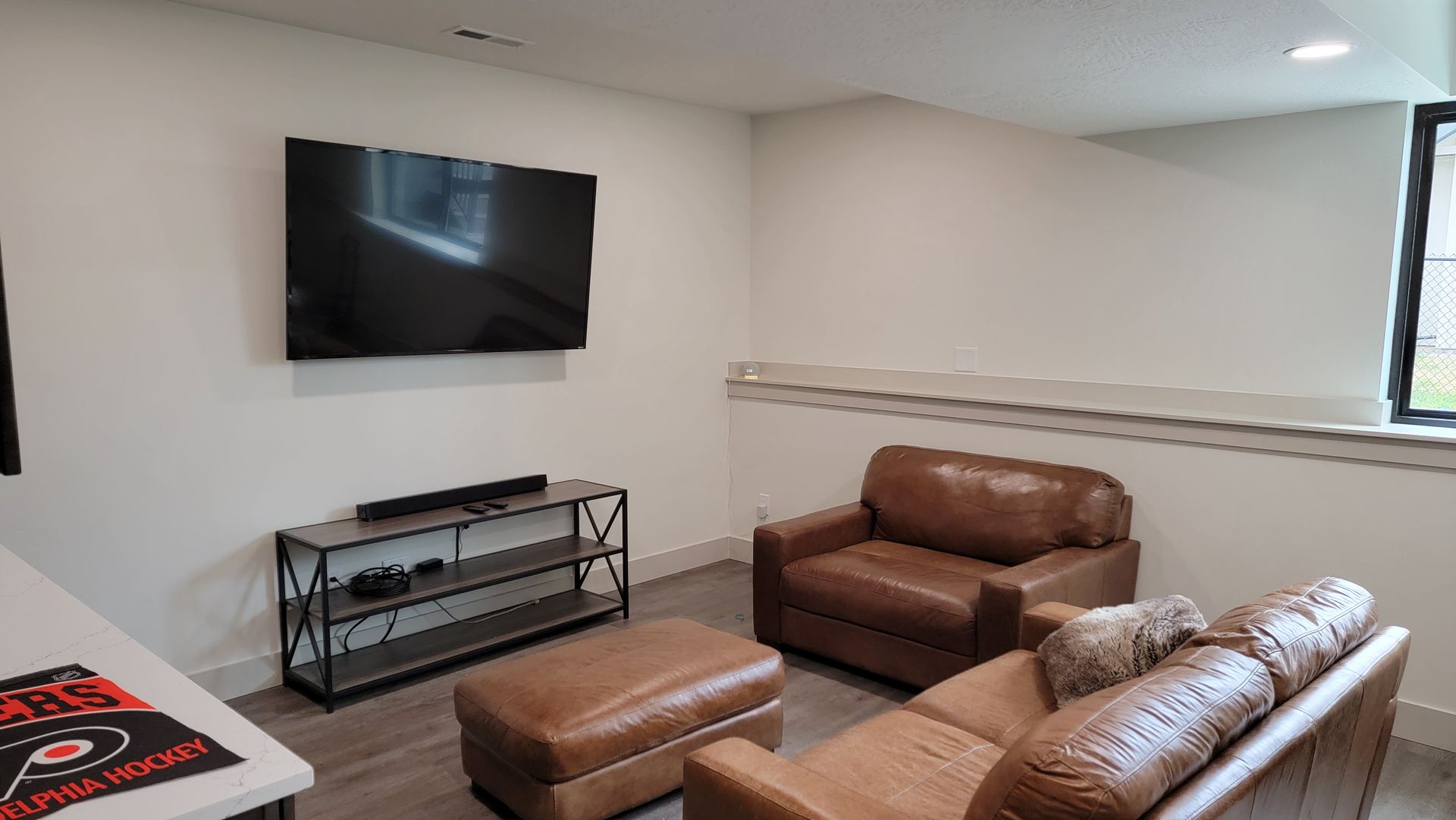Wall mounted TV and media console in Miller Creek Missoula Montana — Smart Home Solutions