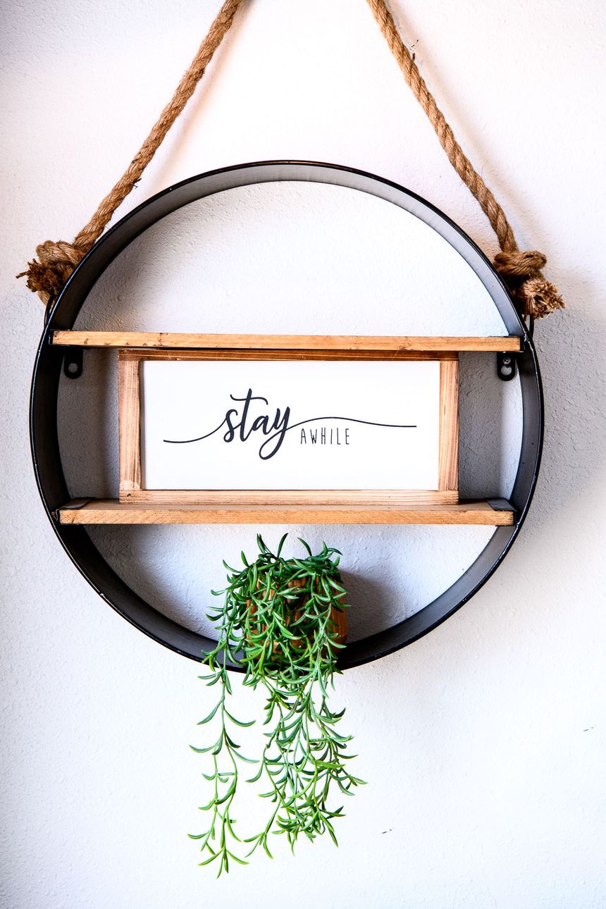 A round shelf with a sign that says stay on it
