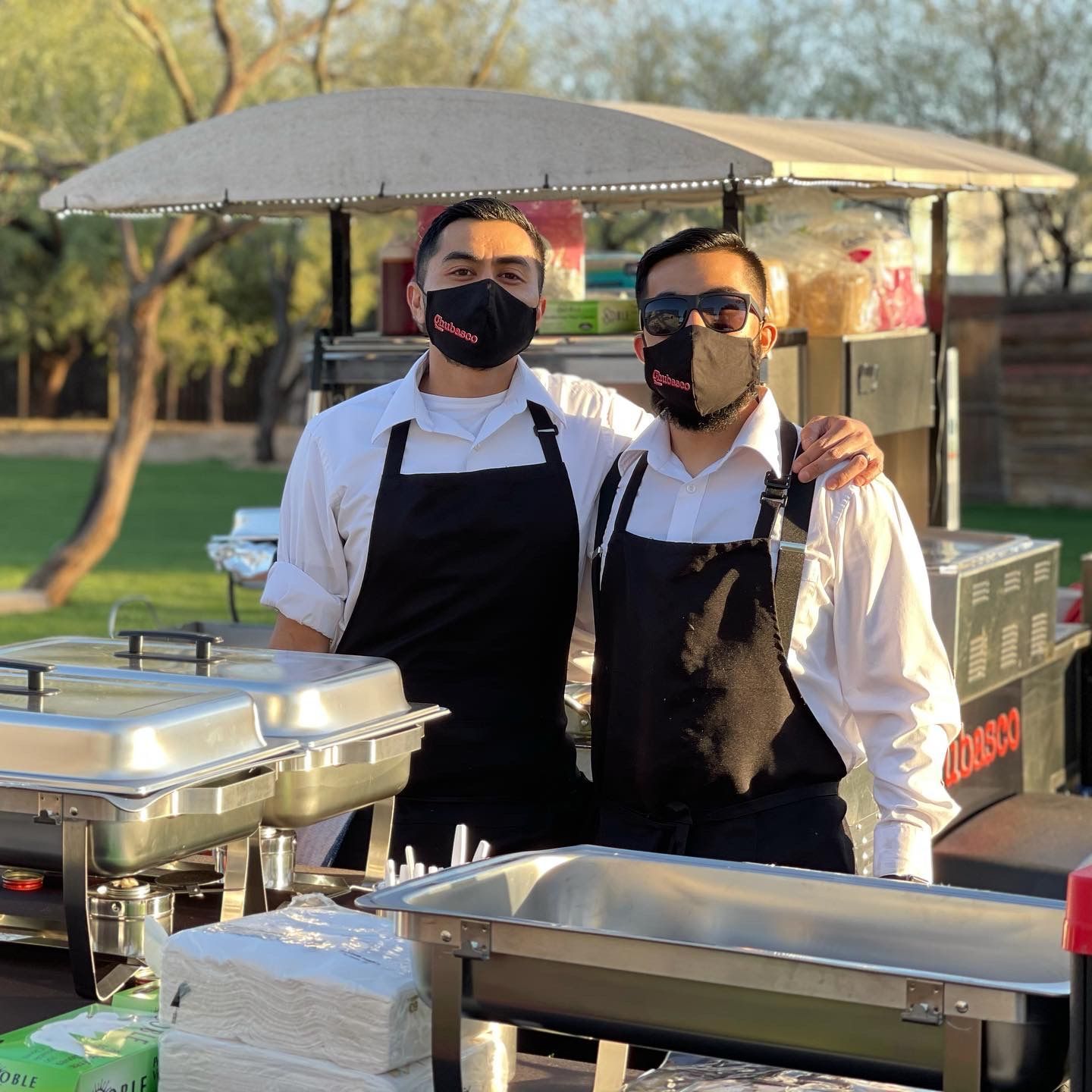 Outdoor catering setup and hospitality service for private event at behind hospitality