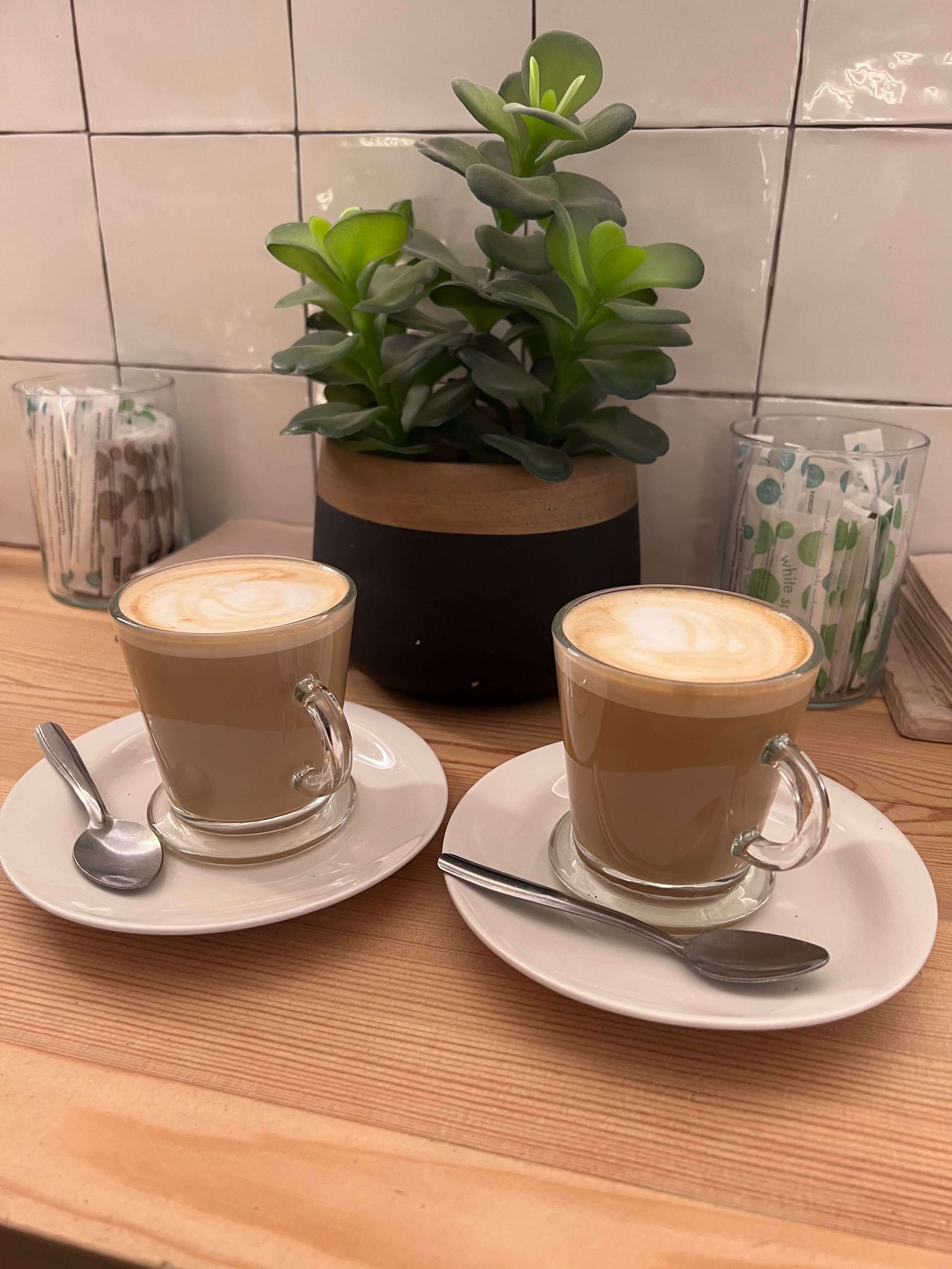 two lattes on small plates