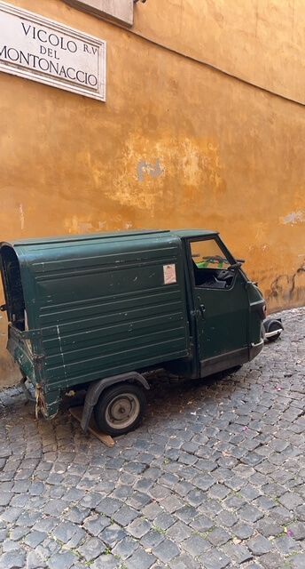 Little green work truck on the street