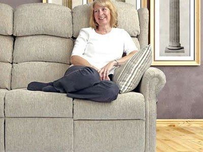 A woman sitting on sofa and sofa pillow