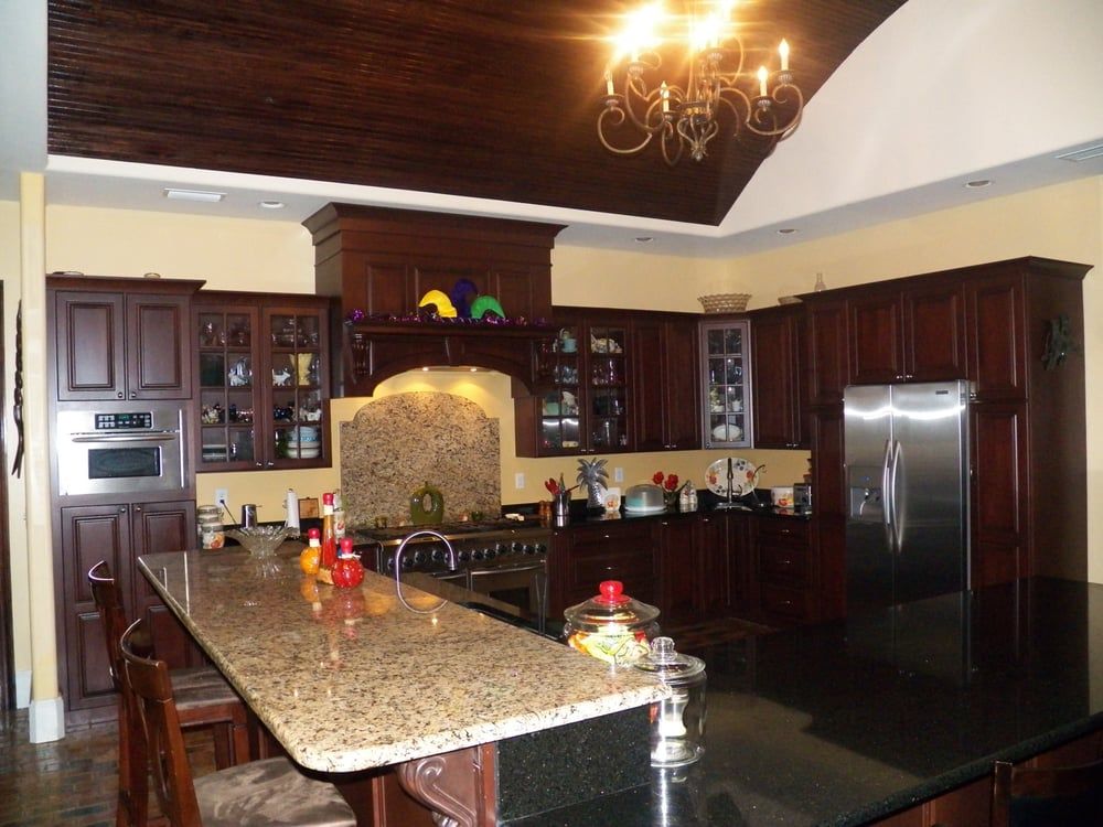 A kitchen with stainless steel appliances and granite counter tops