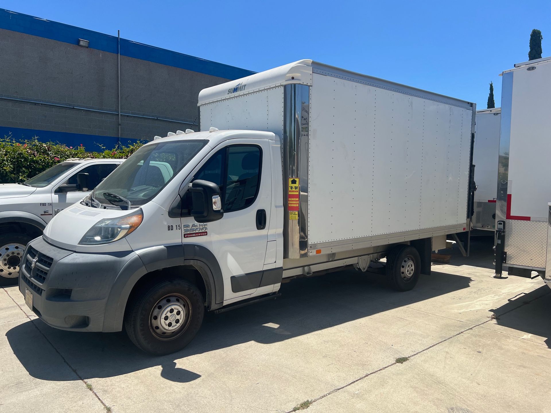 White cargo van parked outdoors.