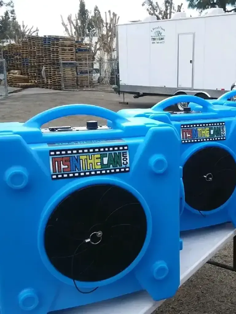 Two blue portable film rewinders with 