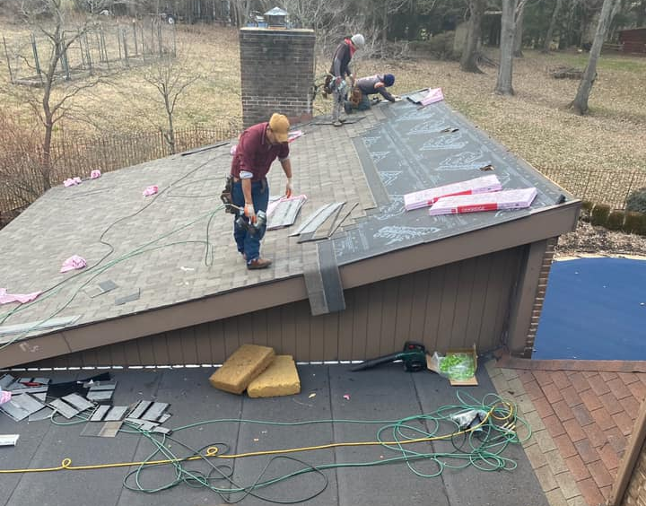 roofers installing underlayment
