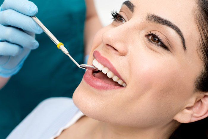 First Dental Visits — A Woman Under Dental Check Up in Richmond, VA