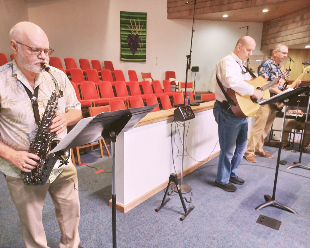 Praise band men playing instruments