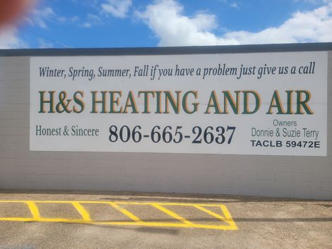 A sign for h & s heating and air says winter spring summer fall if you have a problem just give us a call