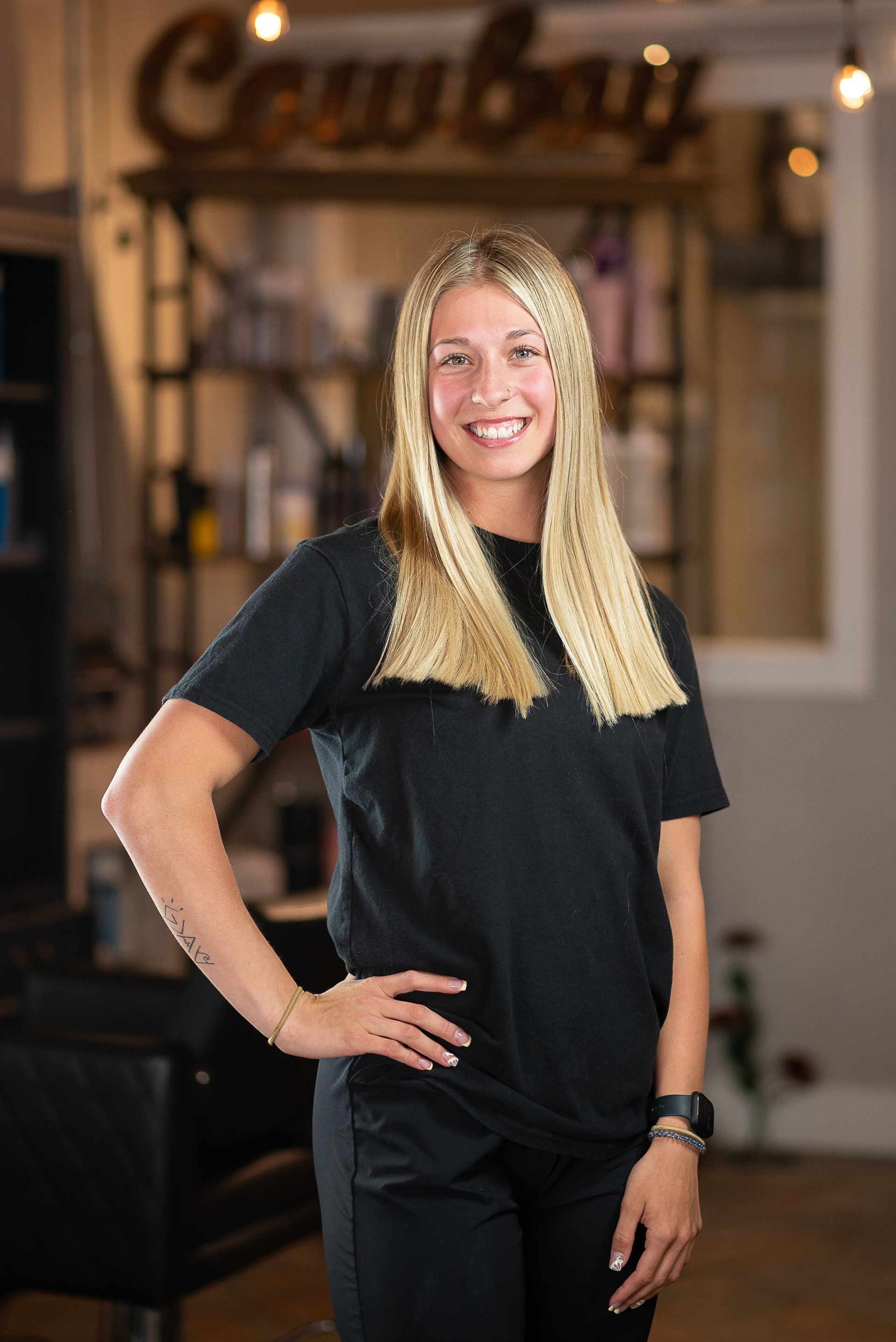 Picture of a Girl with a Black Shirt and Blonde Hair — Laramie, Wy — Luna Salon & Med Spa