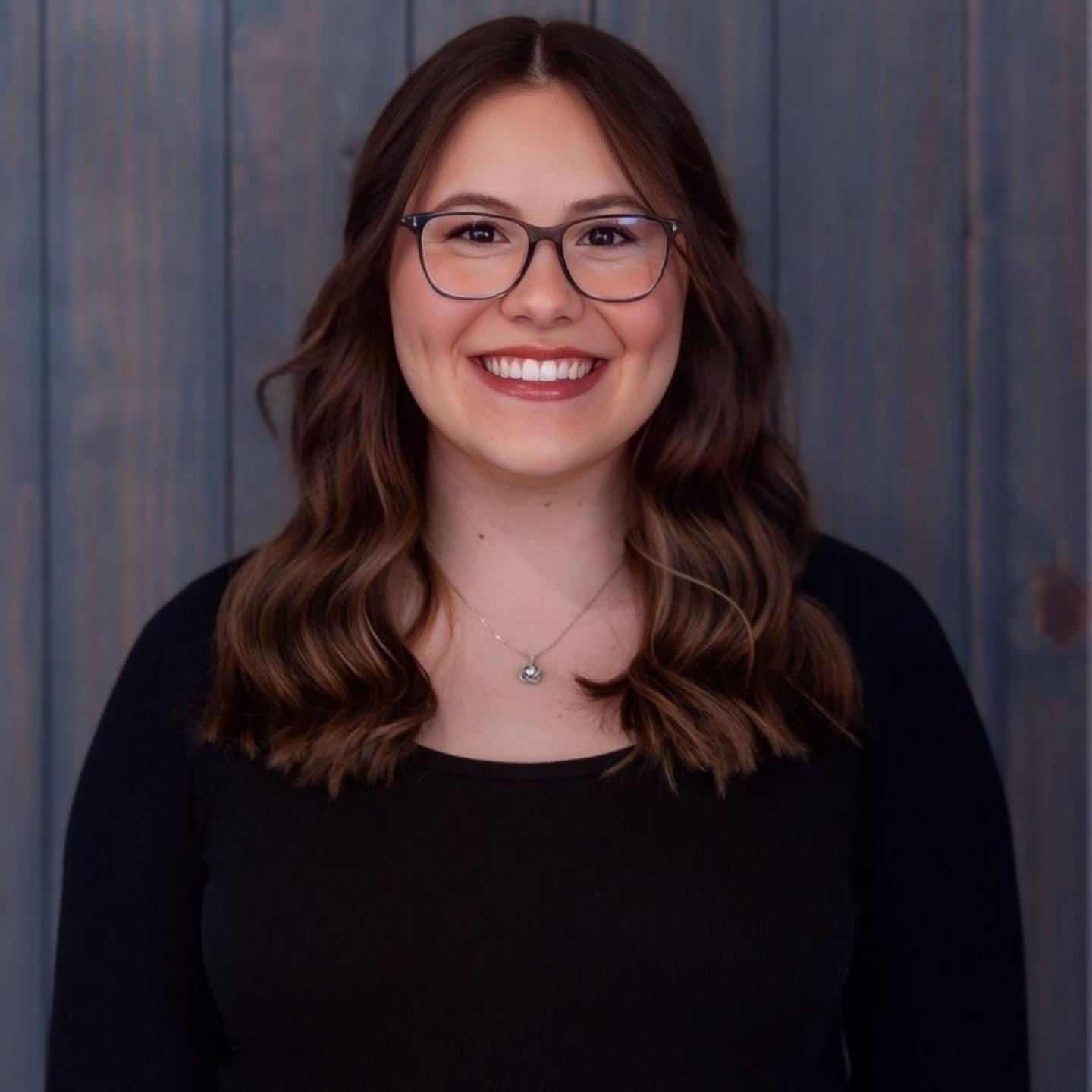 Picture of a Girl with a Black Shirt and Blonde Hair — Laramie, Wy — Luna Salon & Med Spa Picture of a Girl with a Black Shirt and Blonde Hair — Laramie, Wy — Luna Salon & Med Spa