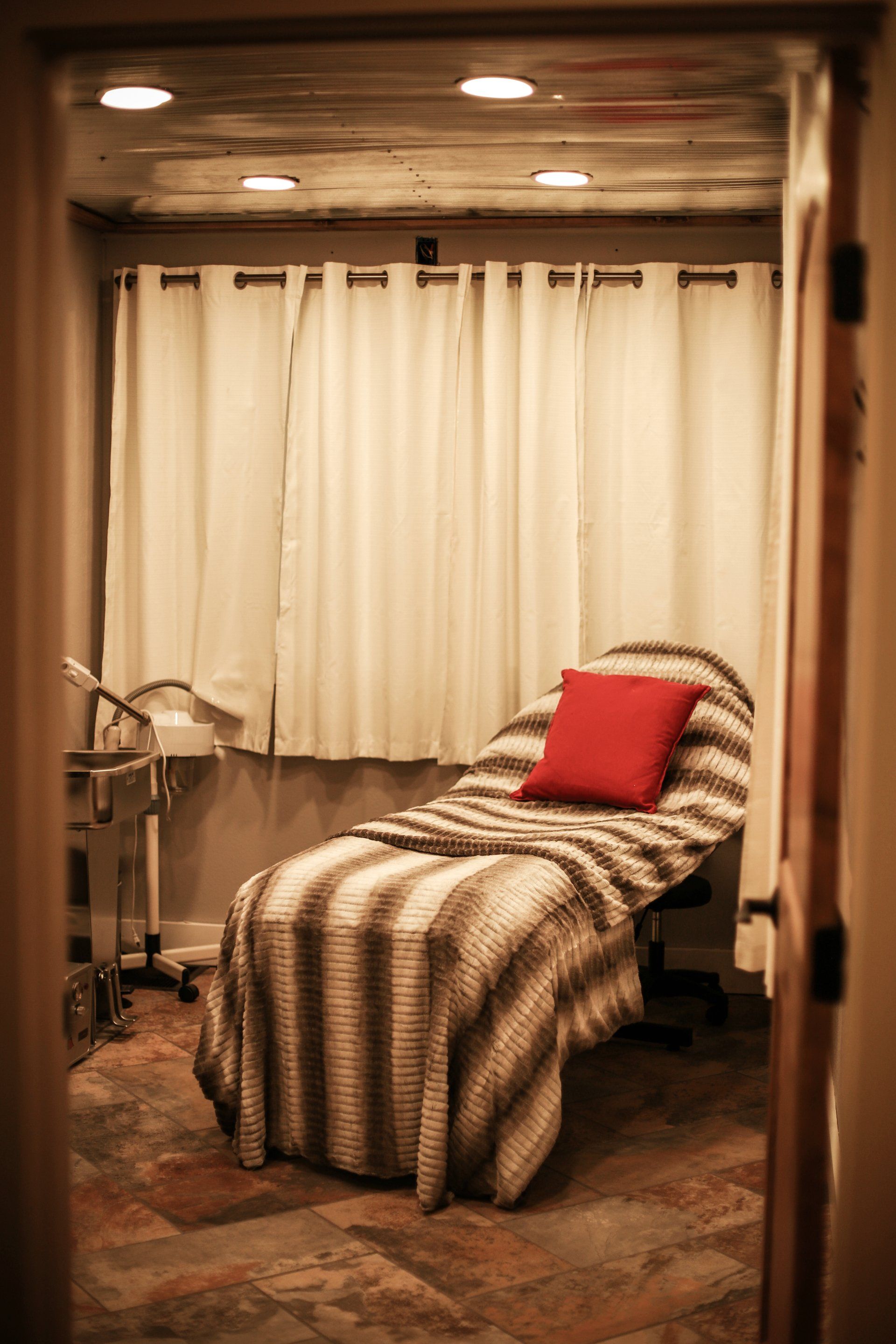 Young Woman Tweezing Her Eyebrows — Laramie, WY — Luna Salon & Med Spa