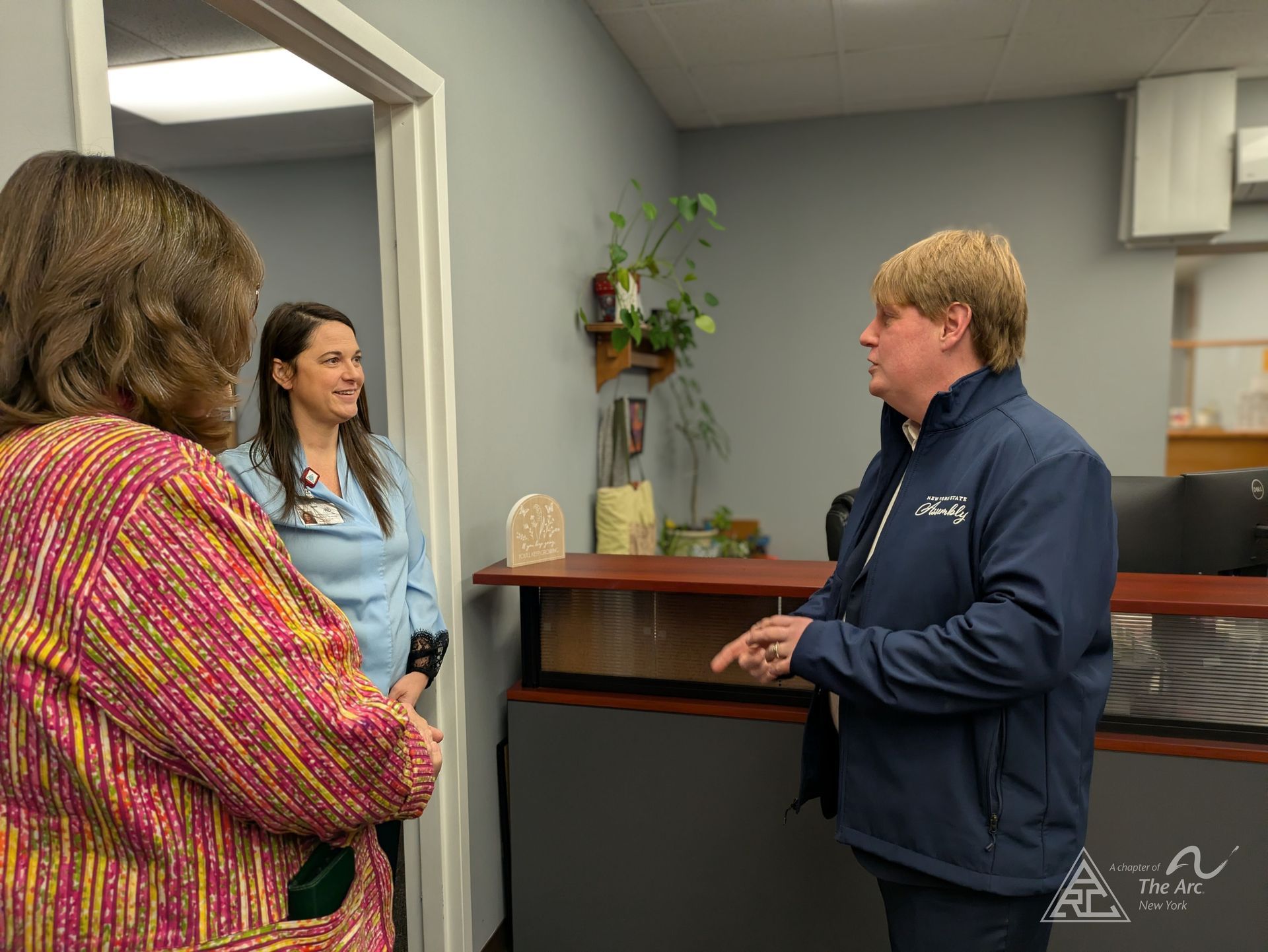 Assemblymember Michael Cashman visiting the administrative offices and speaking to staff.