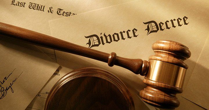 gavel lying on divorce papers