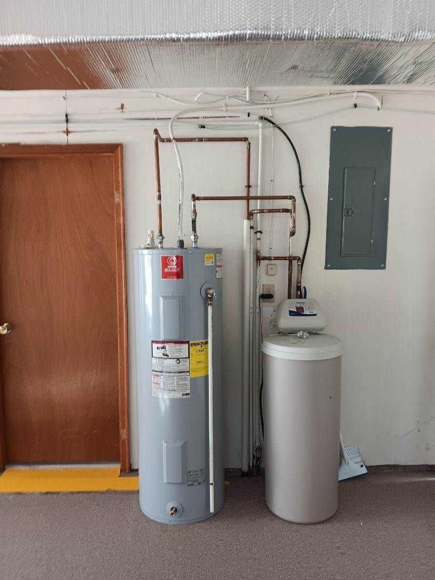 A Water Heater in A Room Next to A Door