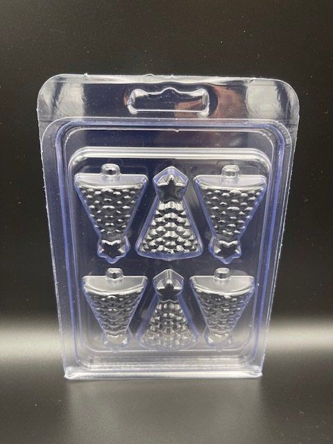 A clear plastic container with a reflection of a person in it is sitting on a table.