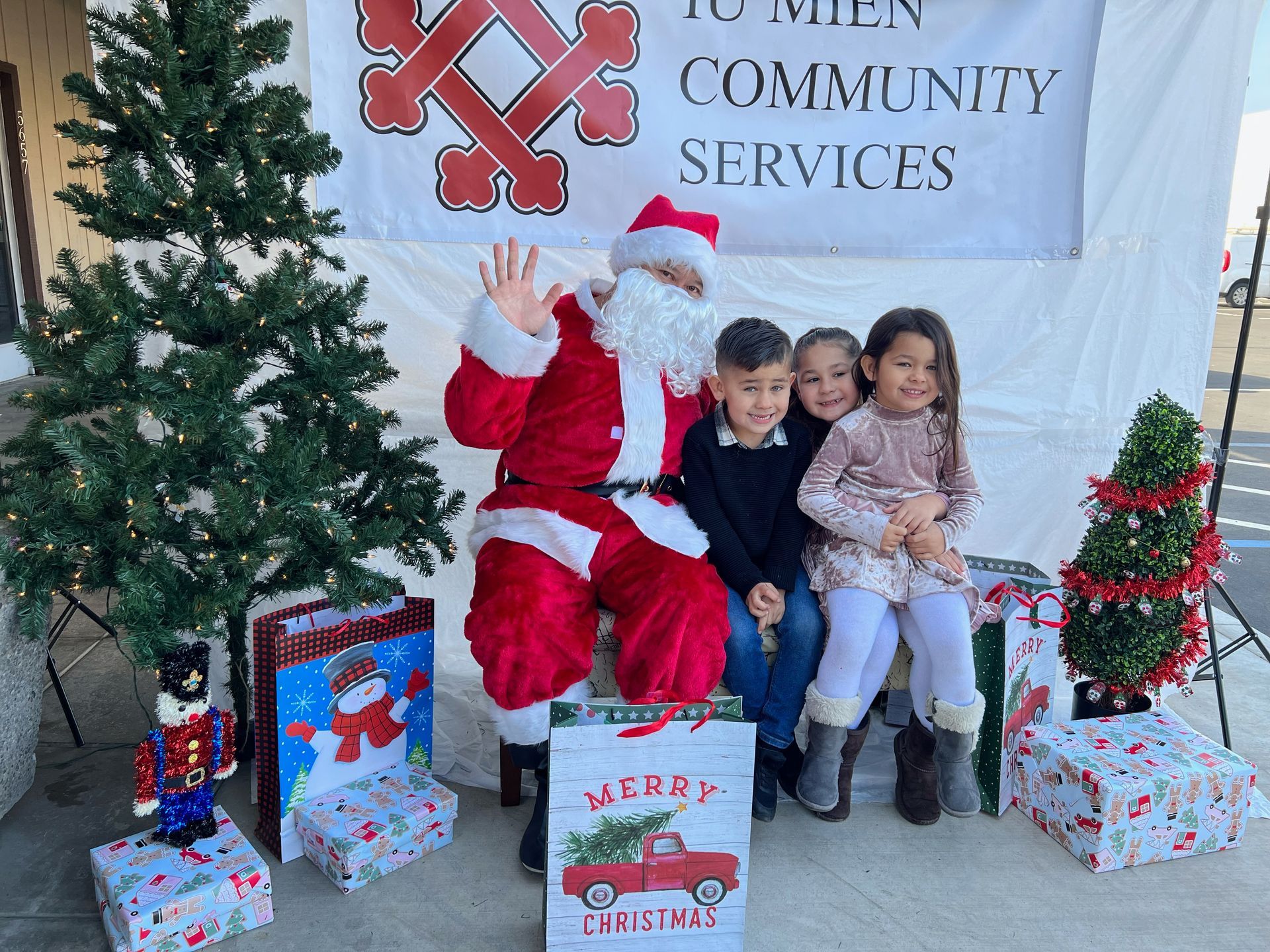 A group of children are posing for a picture with santa claus.