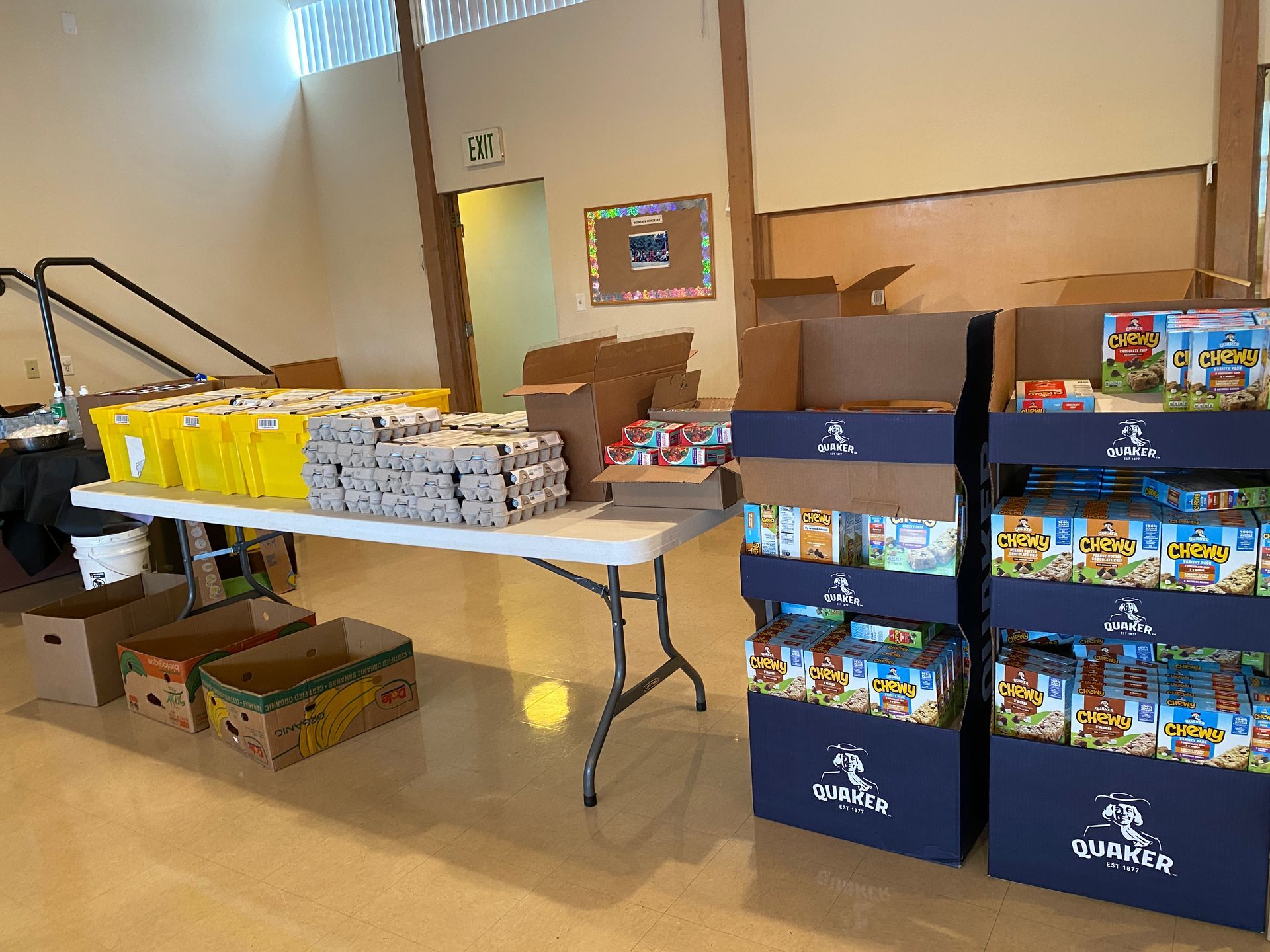A table with boxes of food on it in a room.