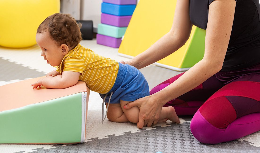 Male toddler in physical therapy after suffering a birth injury in Pennsylvania.