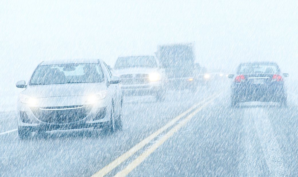 winter driving with low visibility and wet, slippery roads