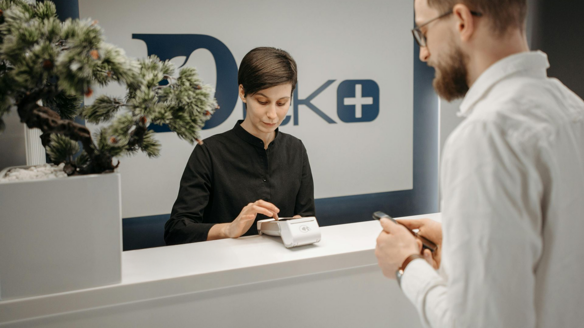 Businessman is handing money to another business person