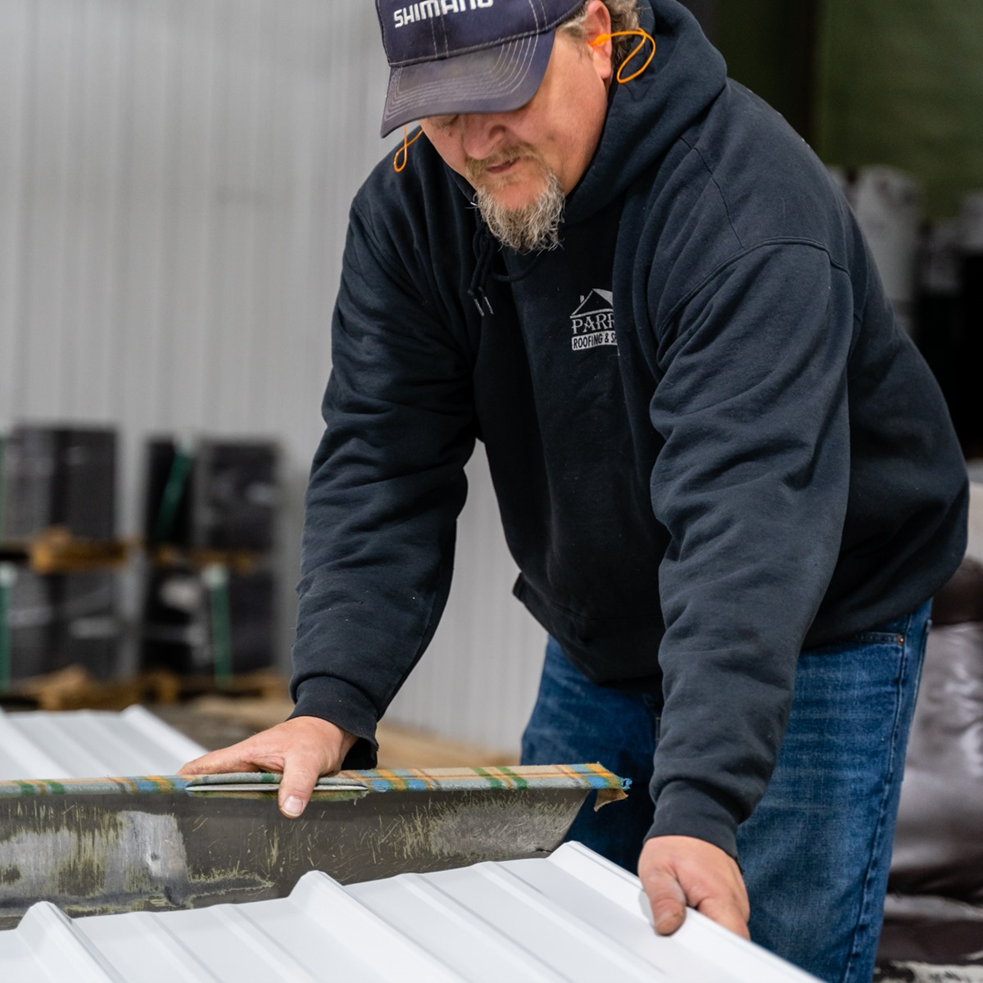 Cutting metal roof — Croswell, MI — Parraghi Roofing & Sheet Metal, LLC