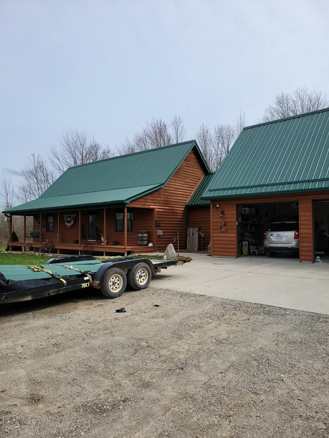Green metal roof with brown walls — Croswell, MI — Parraghi Roofing & Sheet Metal, LLC