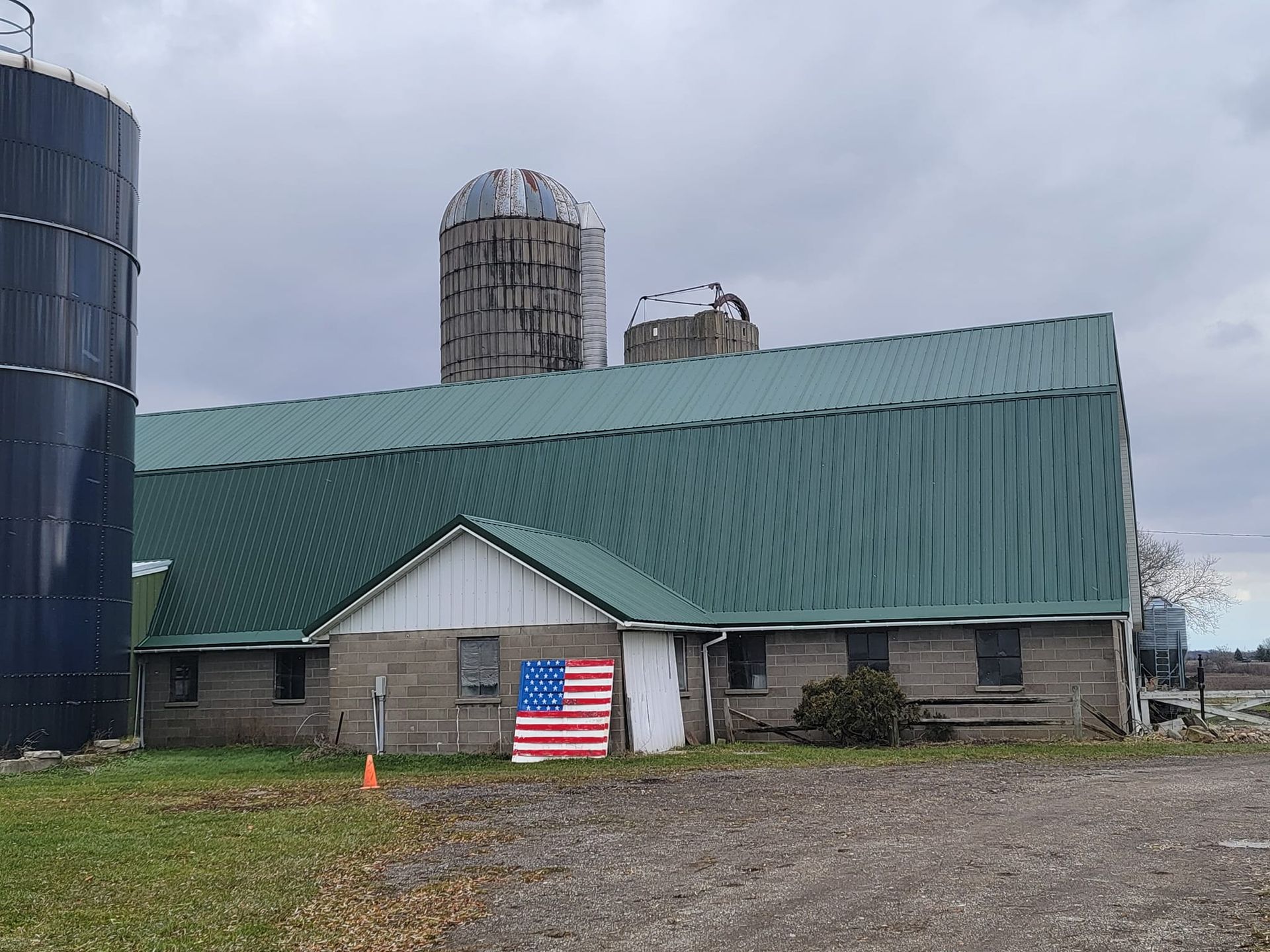Green metal roof  with rounded shape building— Croswell, MI — Parraghi Roofing & Sheet Metal, LLC
