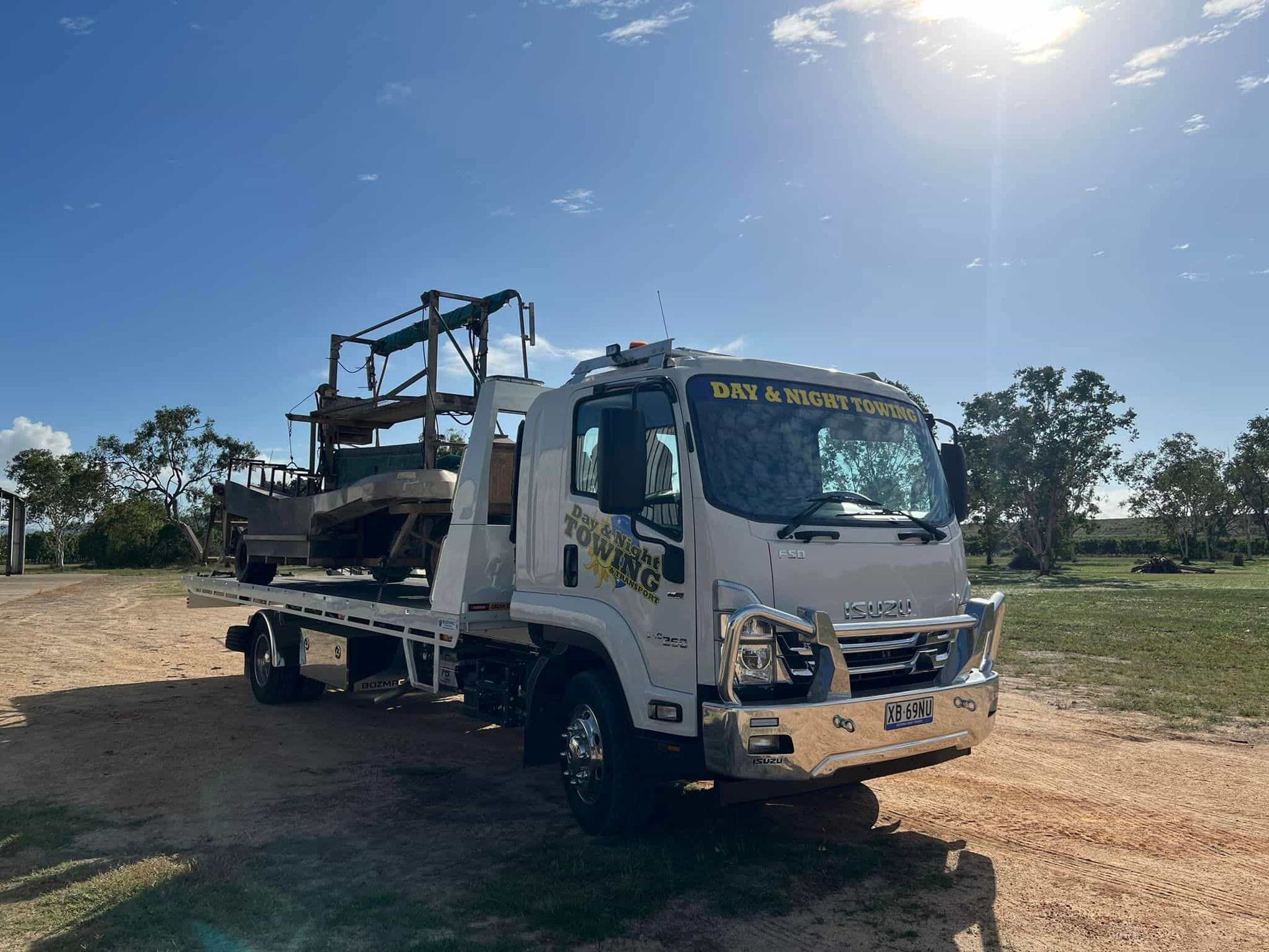 A Boat Is On The Truck — Day & Night Towing & Transport In Condon, QLD