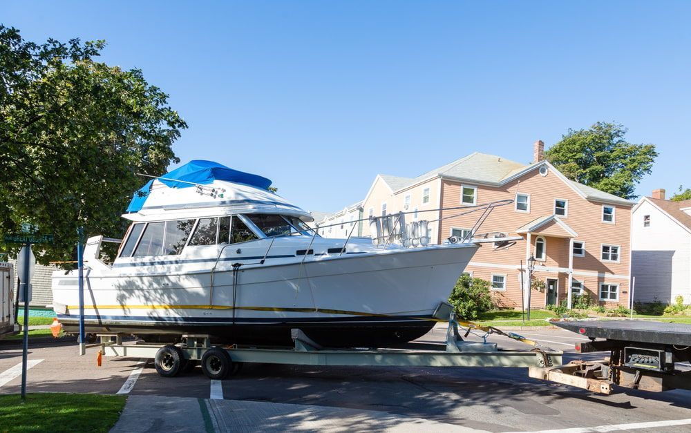 A Boat Is Sitting On A Trailer — Day & Night Towing & Transport In Condon, QLD