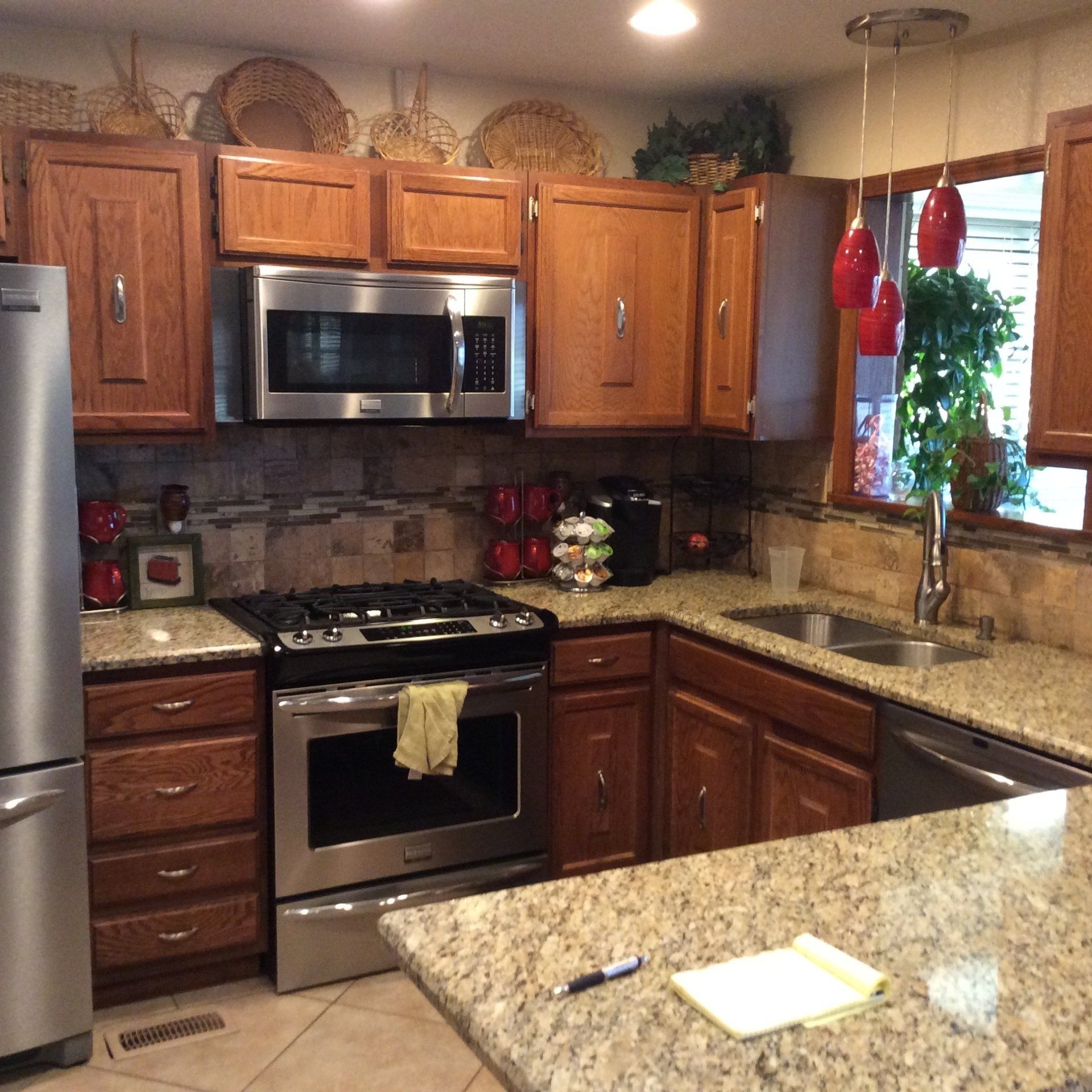 A kitchen with stainless steel appliances and granite counter tops