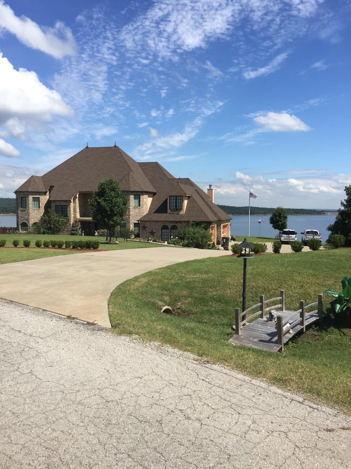 A large house with a tractor parked in front of it