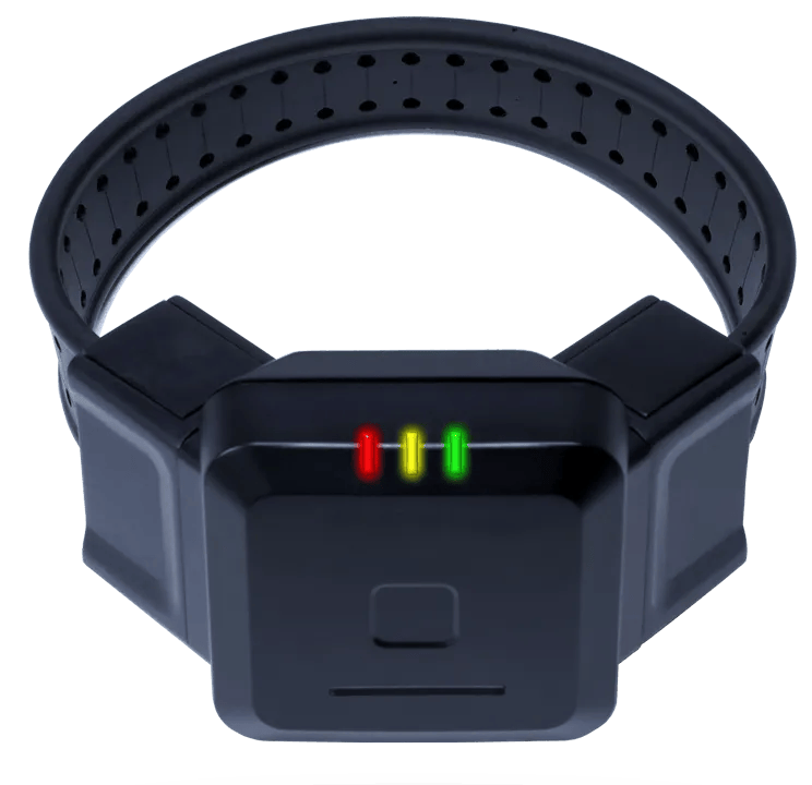 A black wristband with three red and green lights on it
