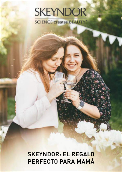 un cartel de skeyndor muestra a dos mujeres sosteniendo copas de vino