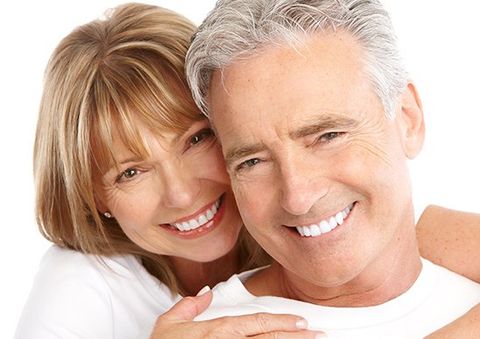 Dental Emergencies — Happy Couple Smiling in Livonia, MI